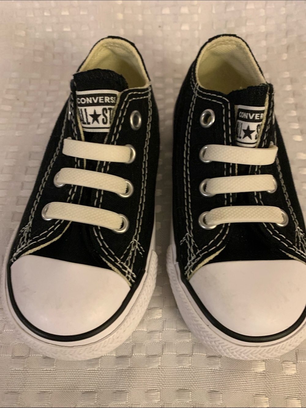 Converse Kids Black Low Top Sneakers with White Accents, size 6.